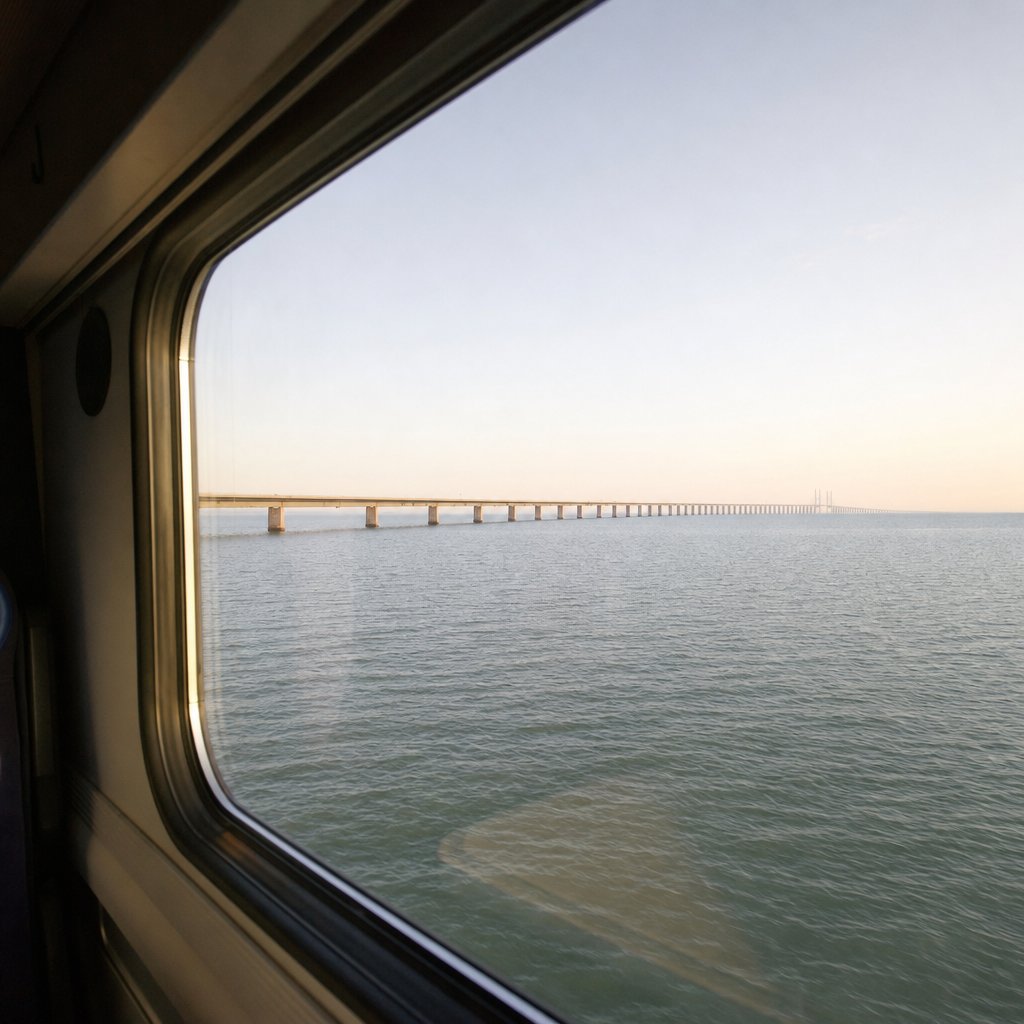 View from a train crossing open water on an international border with no checkpoint